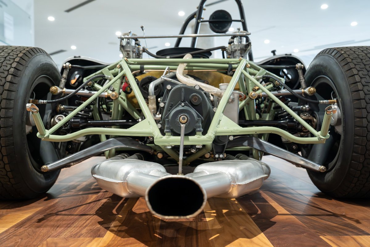 1964 Elva Porsche 4-Cam rear view, showing chassis, suspension, exhaust, and tire.