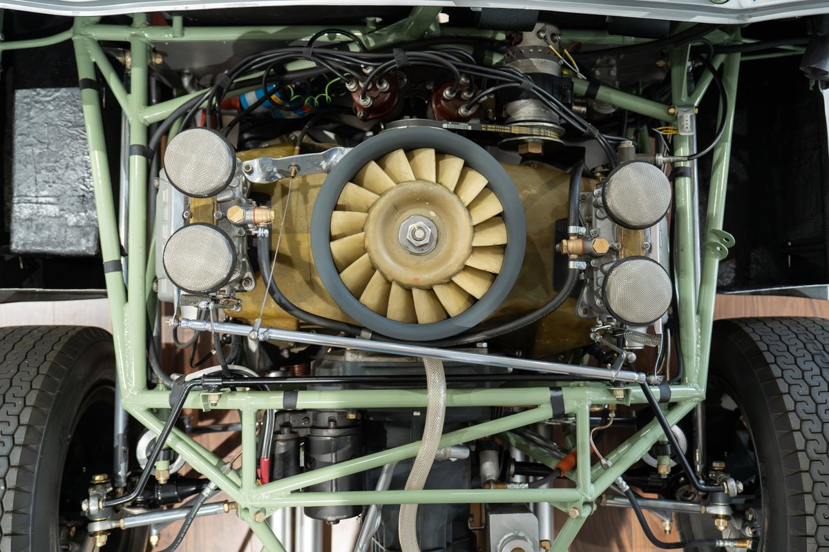 1964 Elva Porsche 4-Cam engine with cooling fan, carburetors, and tubular chassis.
