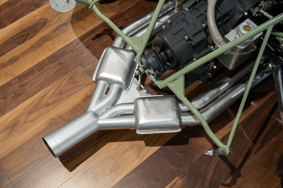 1964 Elva Porsche 4-cam engine with stainless steel exhaust headers and mufflers.