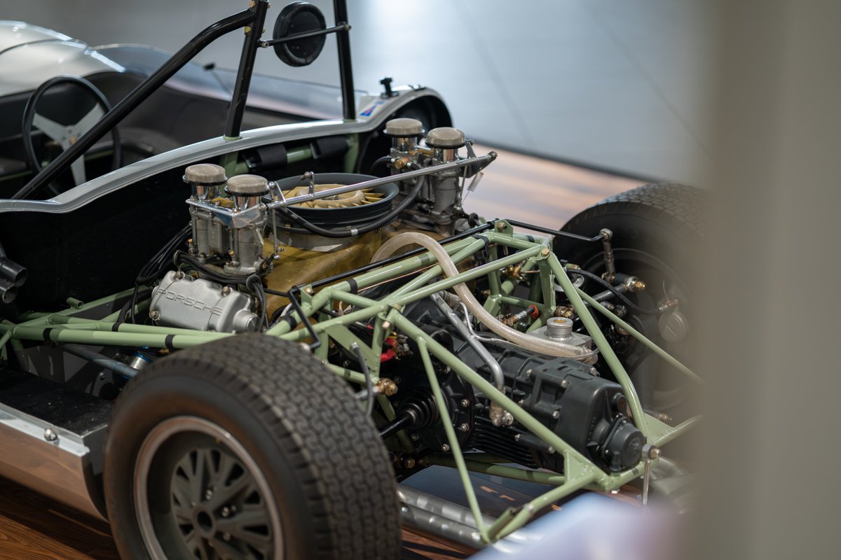 1964 Elva Porsche 4-Cam race car engine bay with dual Weber carburetors and tubular chassis.