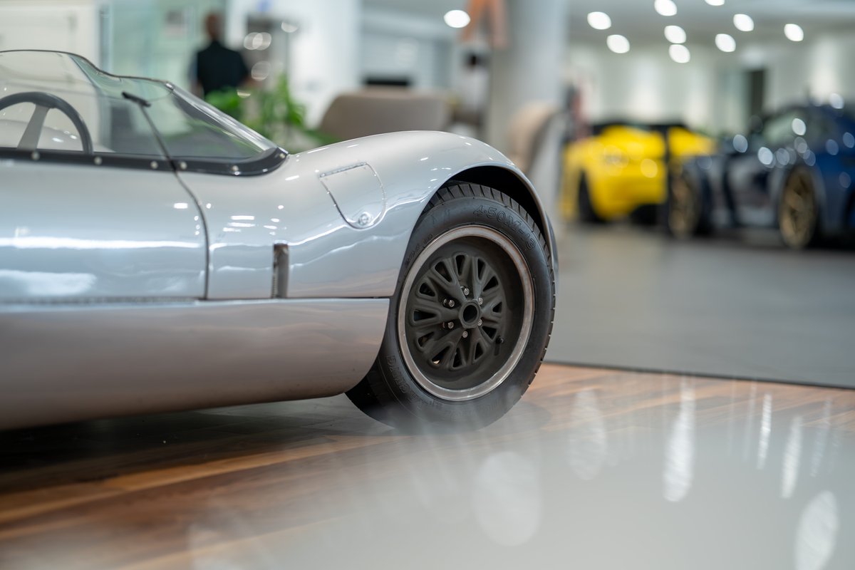 1964 Elva Porsche 4-Cam in silver, showing close-up of the intricate multi-spoke rim.