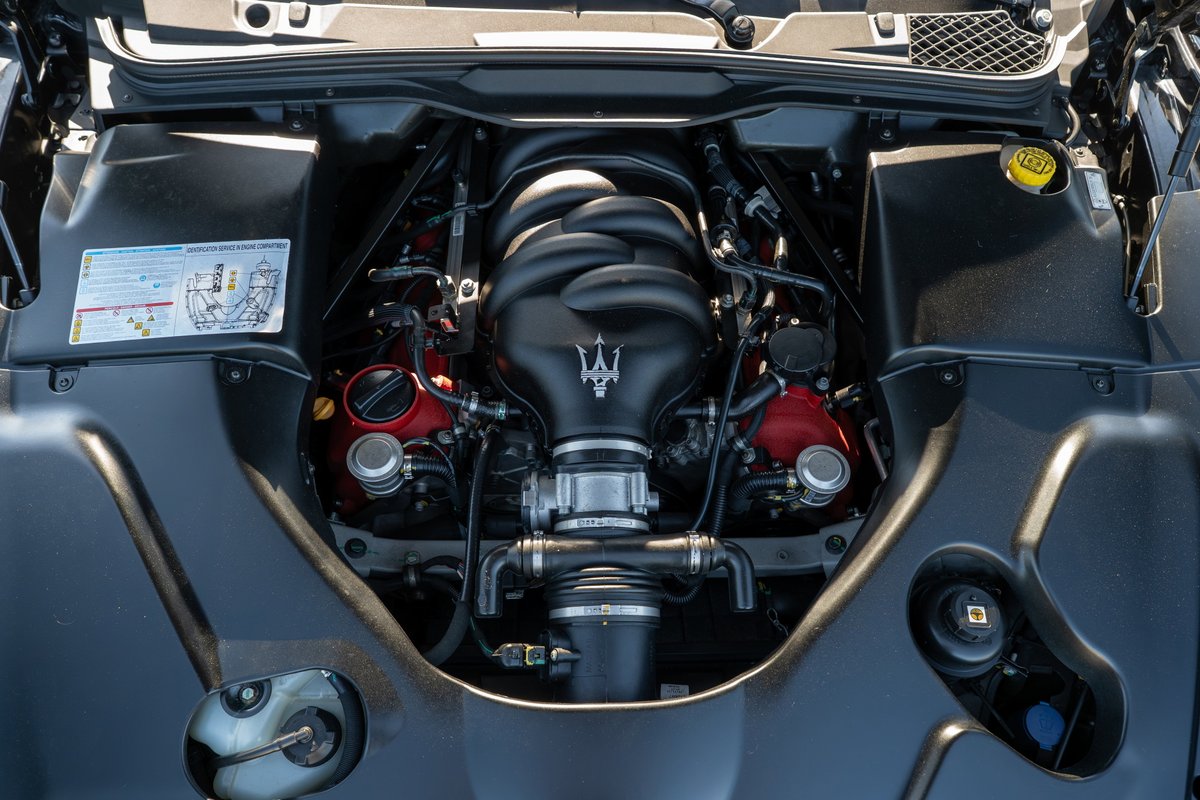 Maserati GranTurismo engine bay with Trident logo on intake manifold.