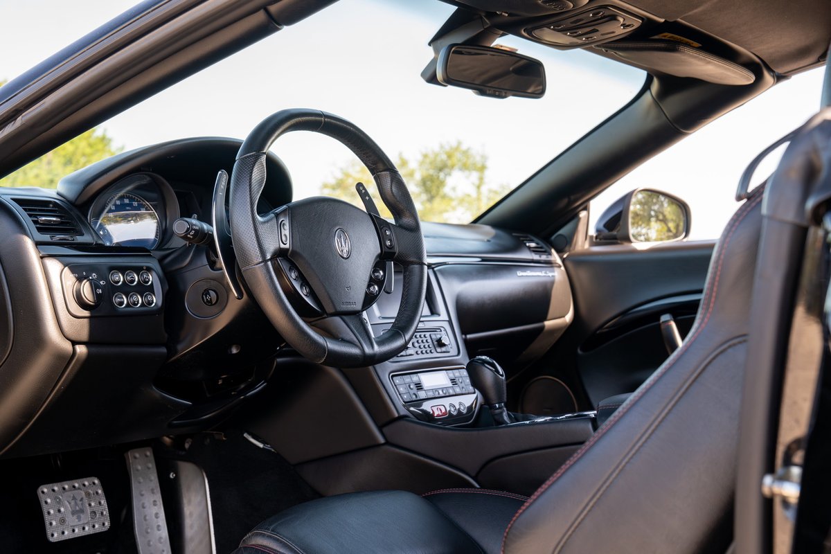 Maserati GranTurismo interior; black leather seats, steering wheel, dashboard trim.