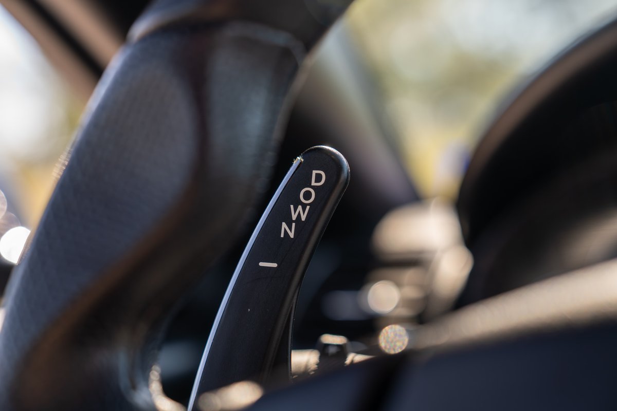 Maserati GranTurismo paddle shifter with "DOWN" text.