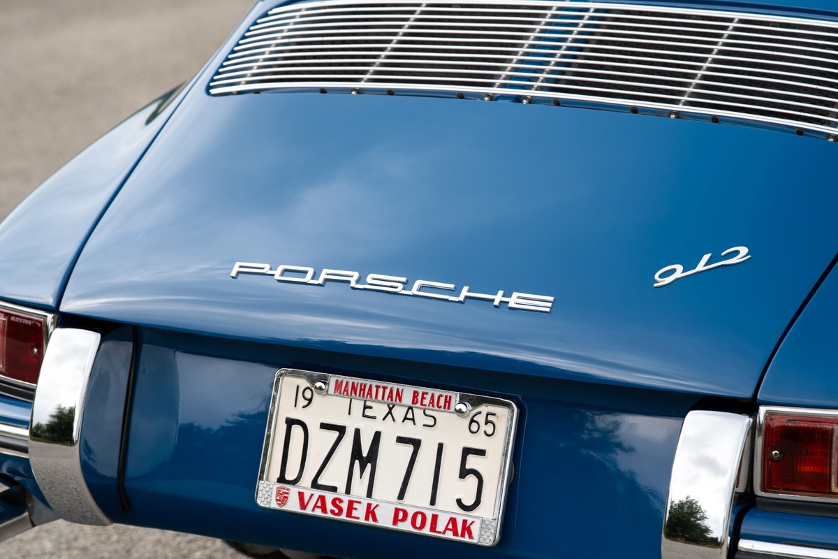 Blue 1965 Porsche 912 rear badging and chrome trim.