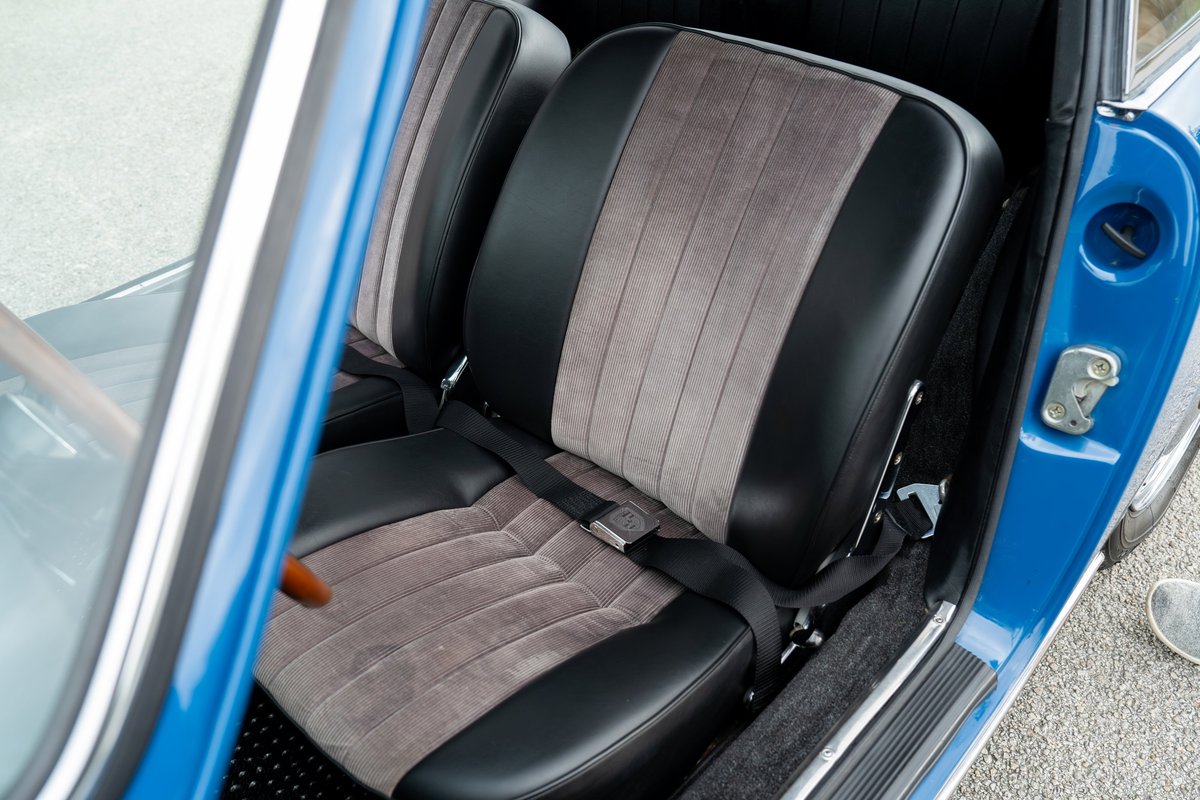 Close up of blue 1965 Porsche 912 interior seats with black and corduroy trim.