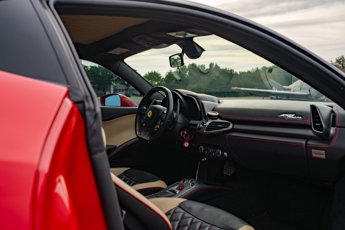 Red Ferrari 458 Italia interior. Black dash with red stitching, quilted tan & black seats.
