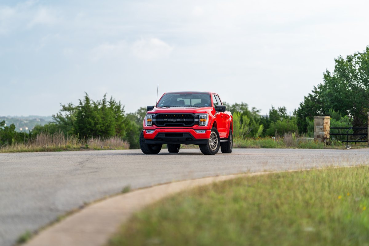 Red 2022 Ford F-150 Roush with aggressive trim and off-road wheels.
