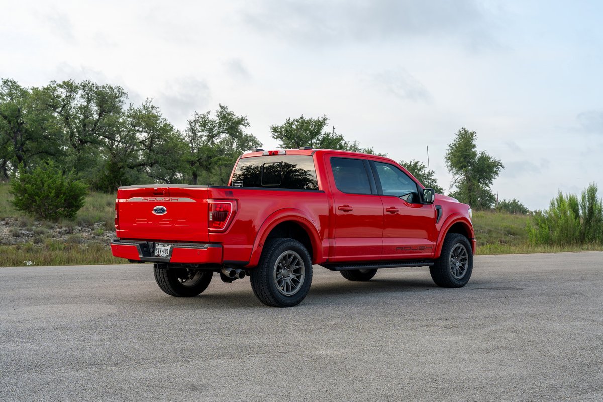 Red 2022 Ford F-150 Roush with dark gray rims and black trim.