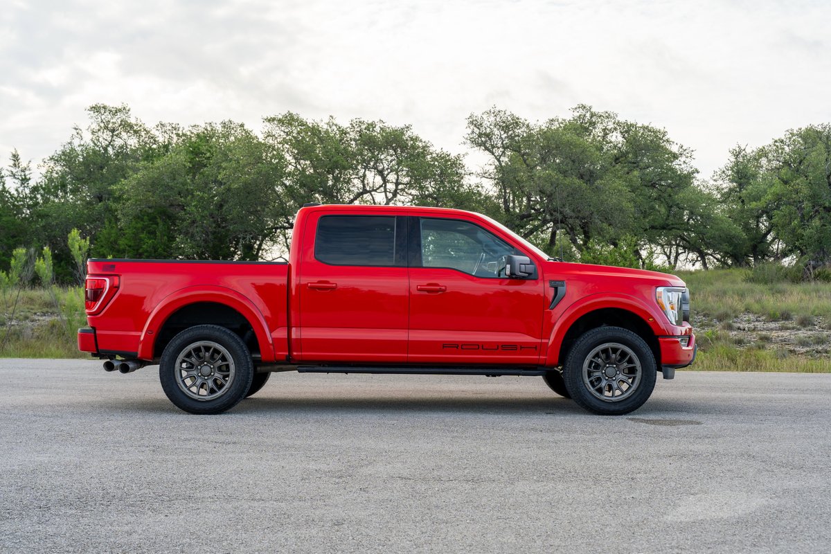 Red 2022 Ford F-150 Roush with dark gray rims and black trim.