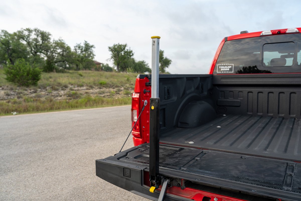 Red 2022 Ford F-150 Roush with tailgate step and bed extender.