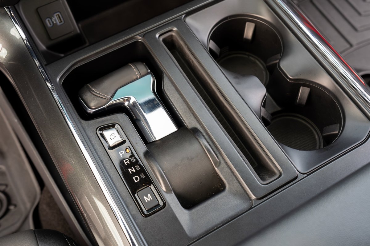 Interior view of a 2022 Ford F-150 Roush gear shifter with park, reverse, neutral, drive, and manual modes.
