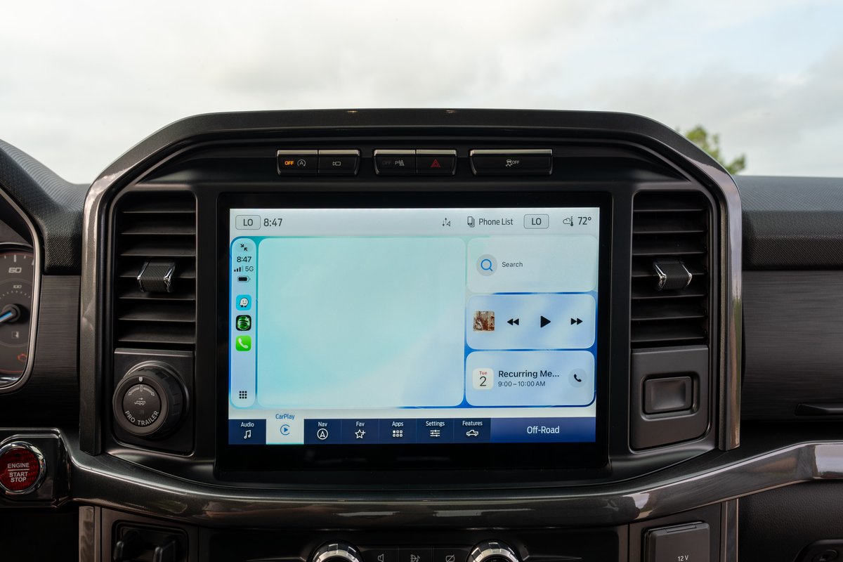 2022 Ford F-150 Roush in red with touchscreen infotainment system and digital cluster.