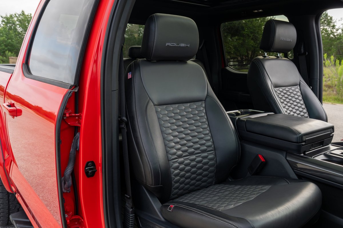 Red 2022 Ford F-150 Roush with black leather interior and embossed seats.