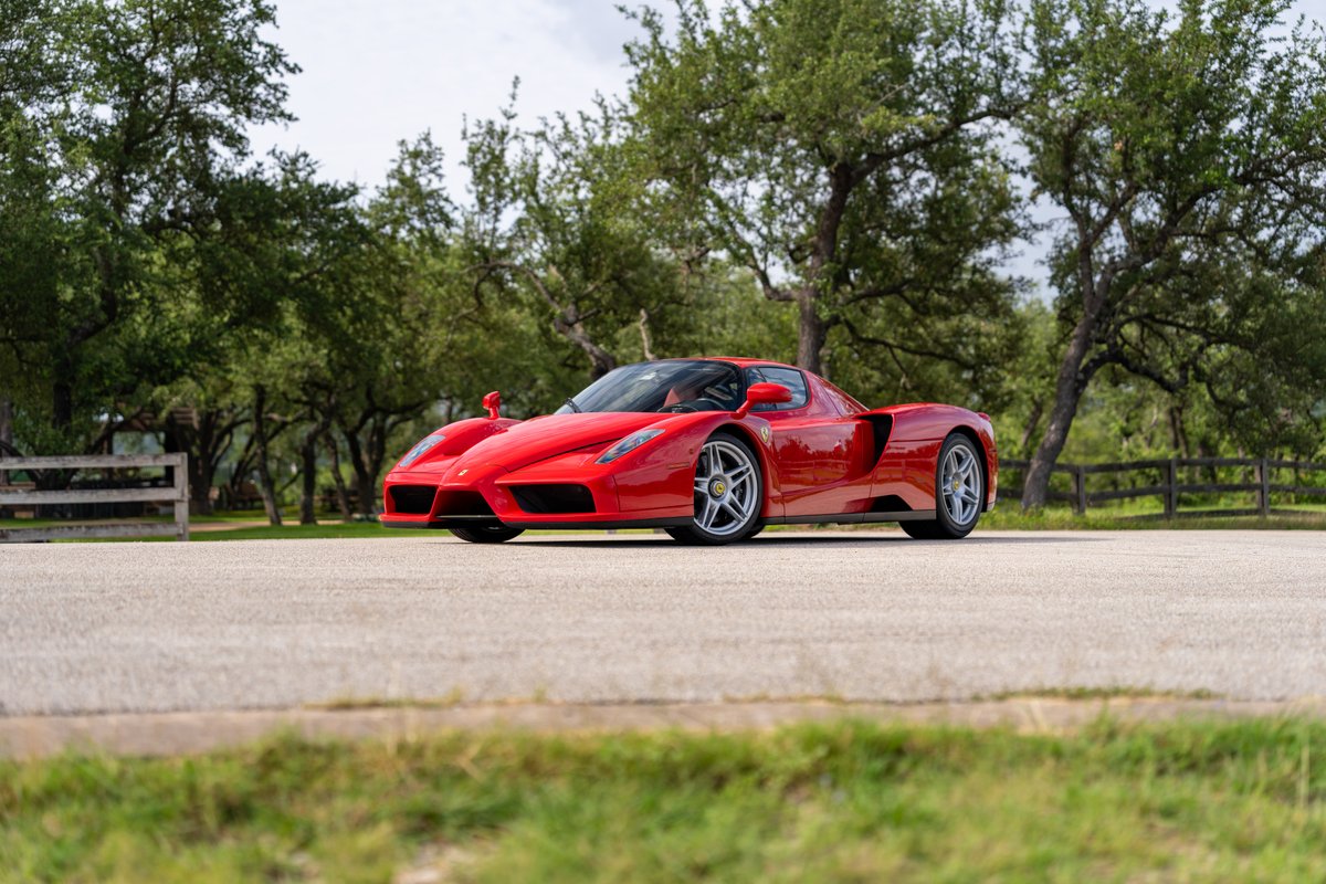Red 2003 Ferrari Enzo with silver alloy rims.