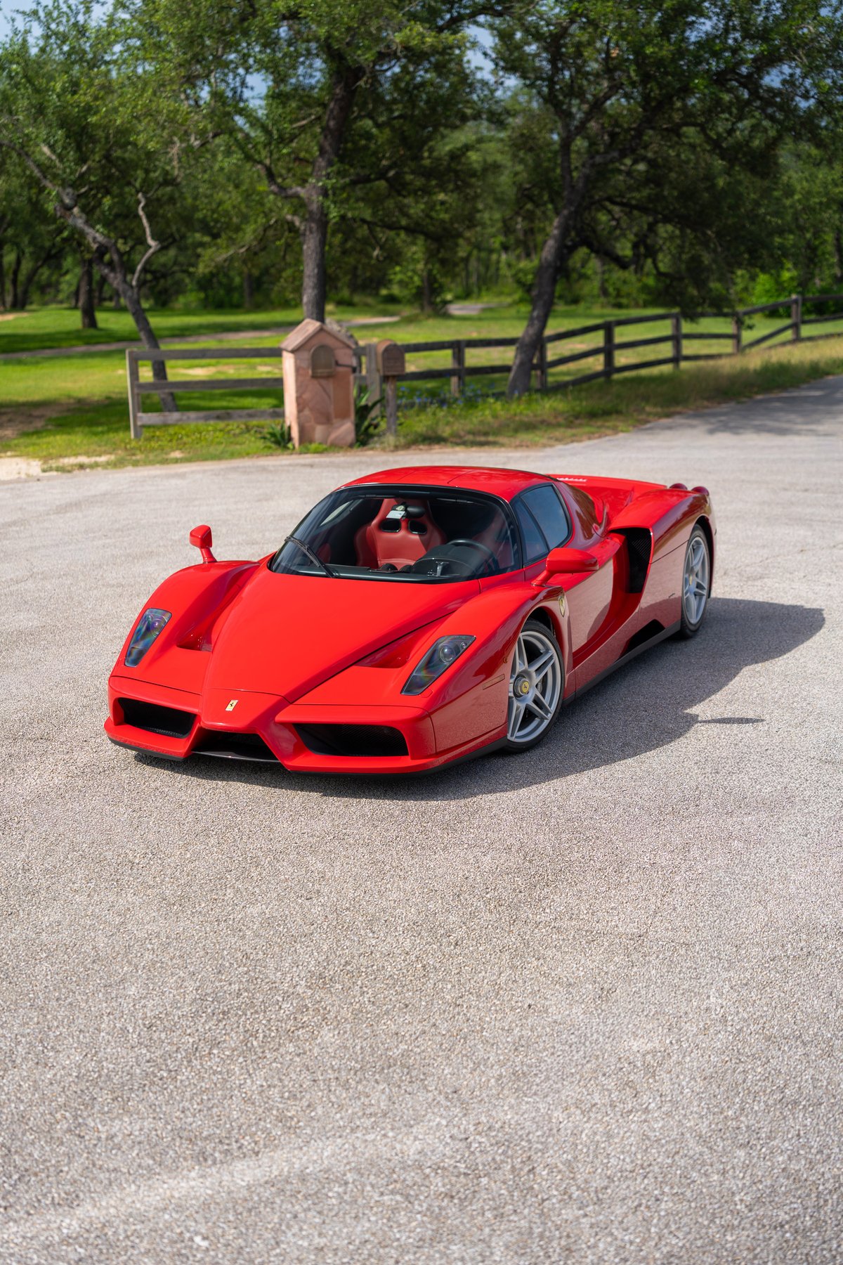 Red 2003 Ferrari Enzo with silver alloy rims.