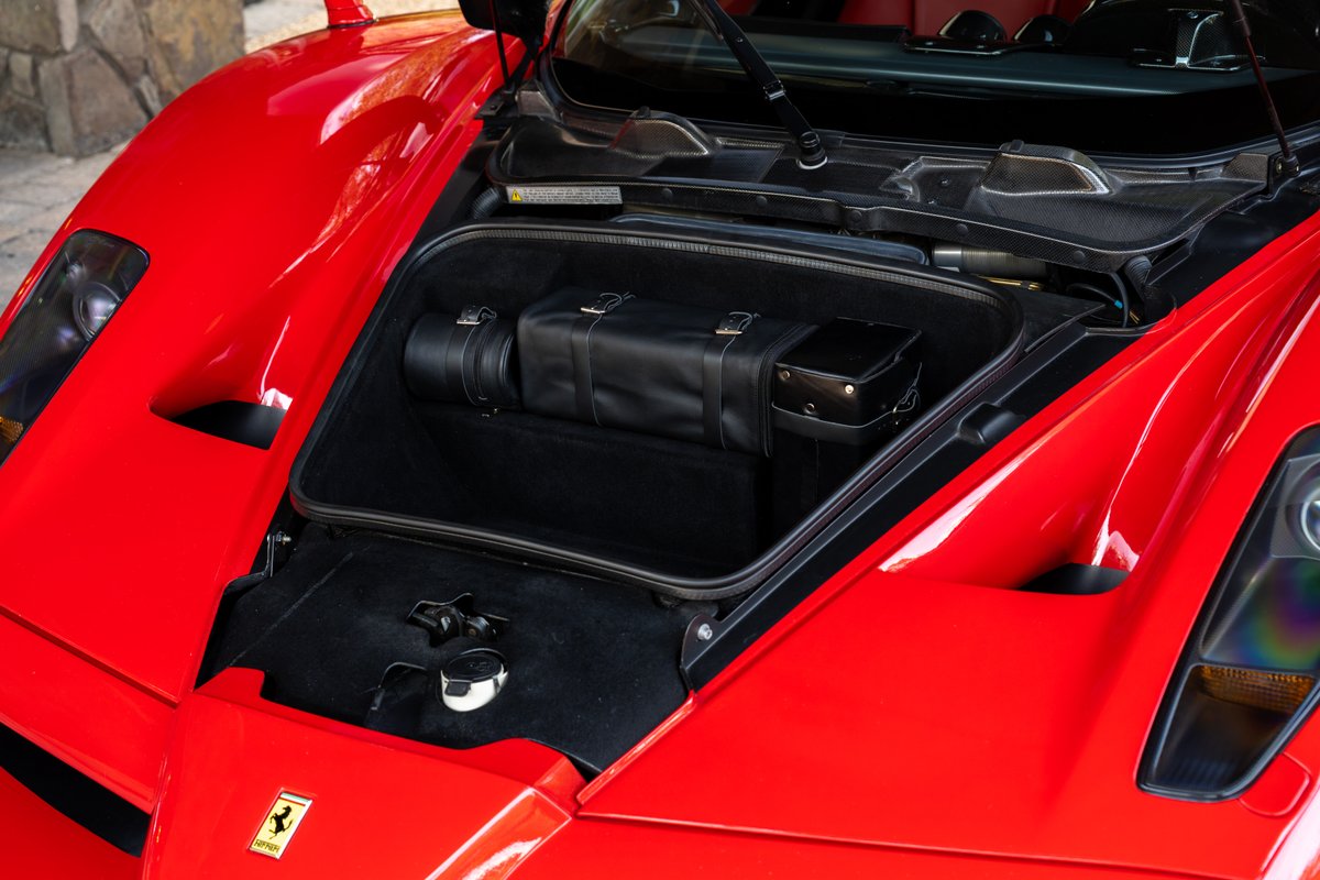 2003 Ferrari Enzo front trunk with black leather luggage.