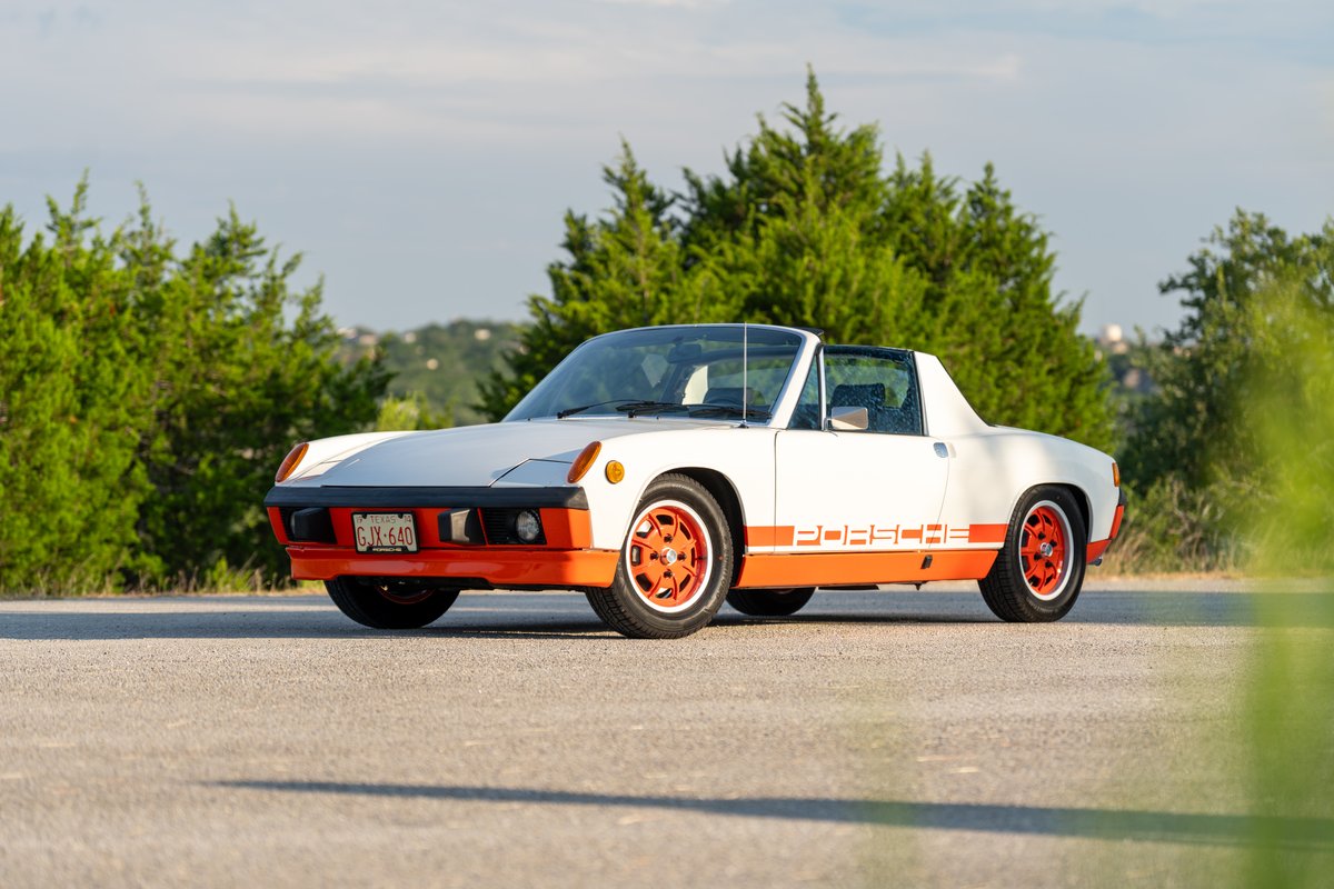 1974 Porsche 914 Can-Am with orange trim, livery, and rims.