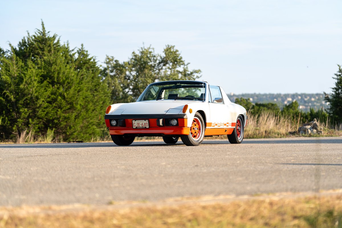 1974 Porsche 914 Can-Am LE in white with orange trim and livery. Features orange rims.