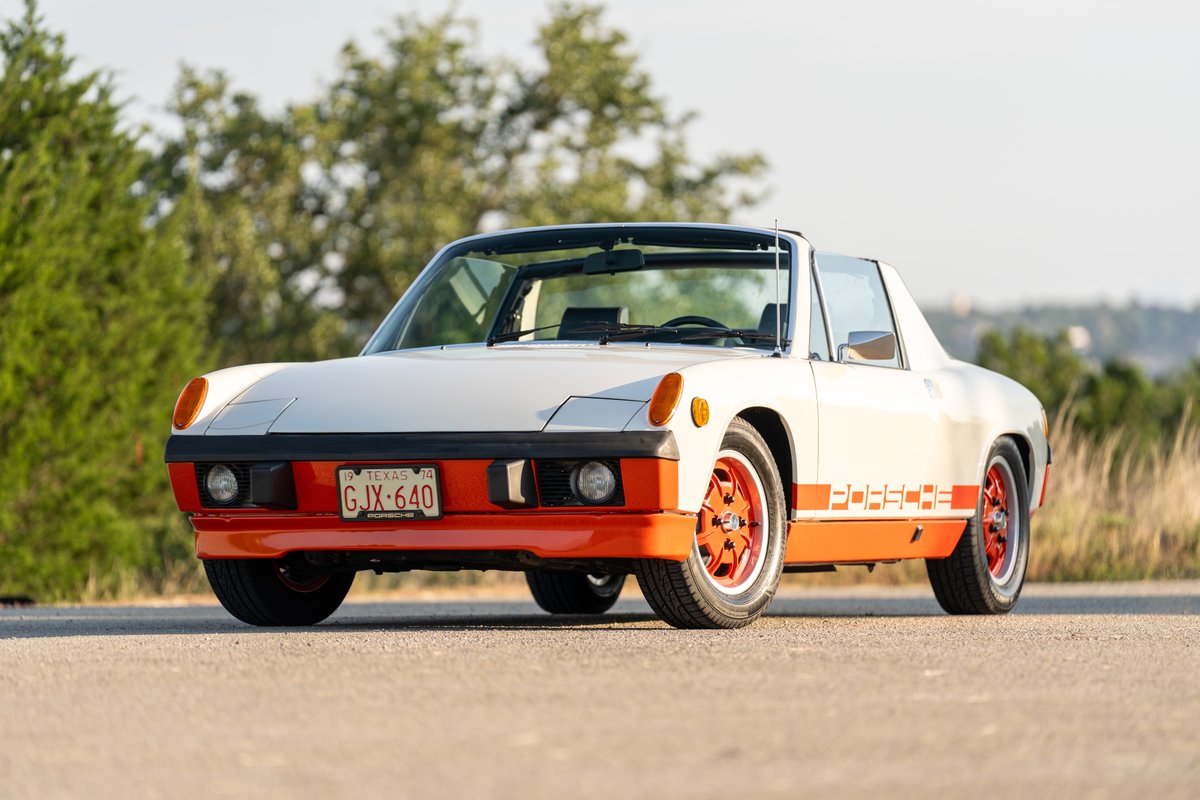 1974 Porsche 914 Can-Am in a white and orange "creamsicle" livery, with orange rims.
