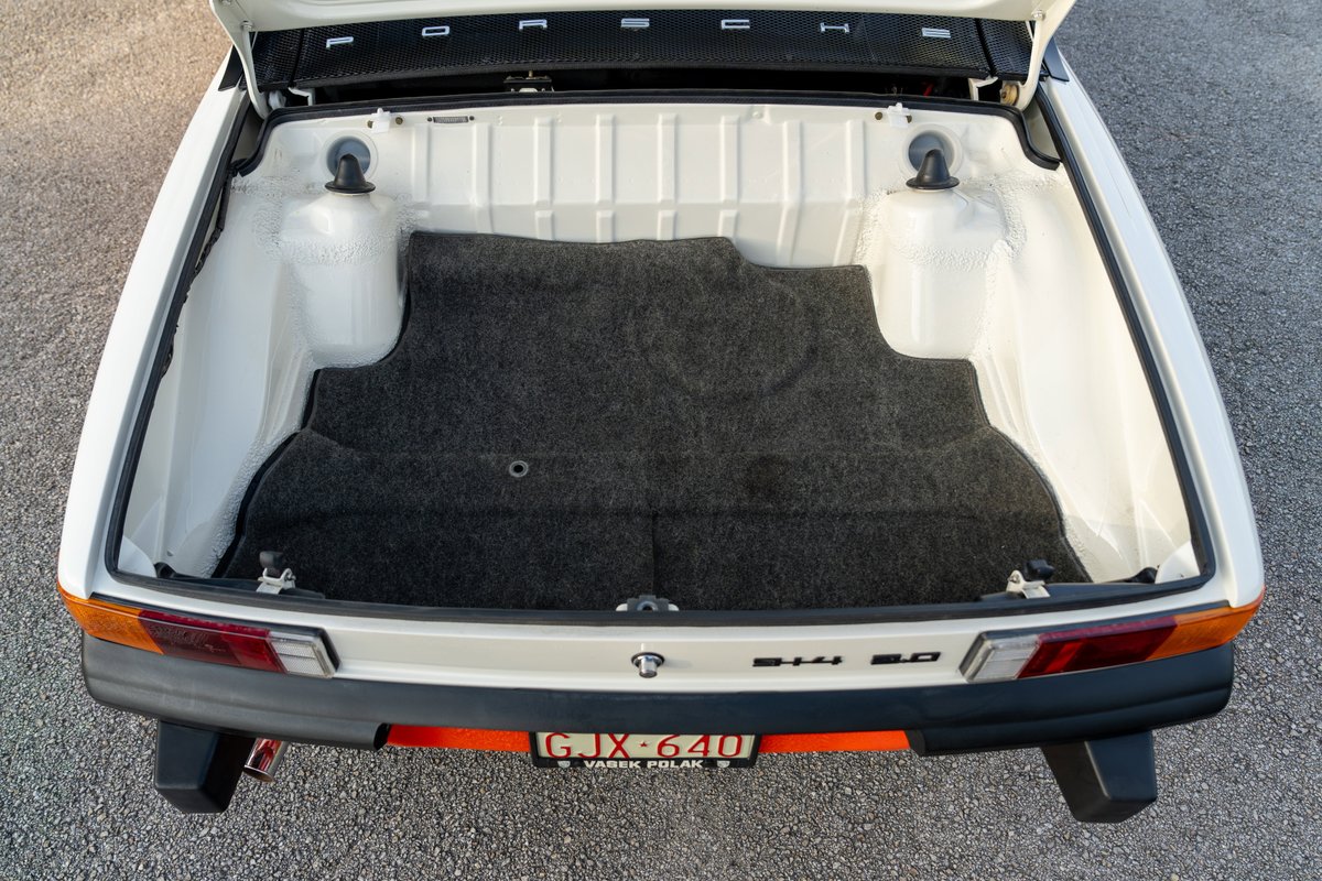 White 1974 Porsche 914 Can-Am LE rear trunk with carpeted floor.