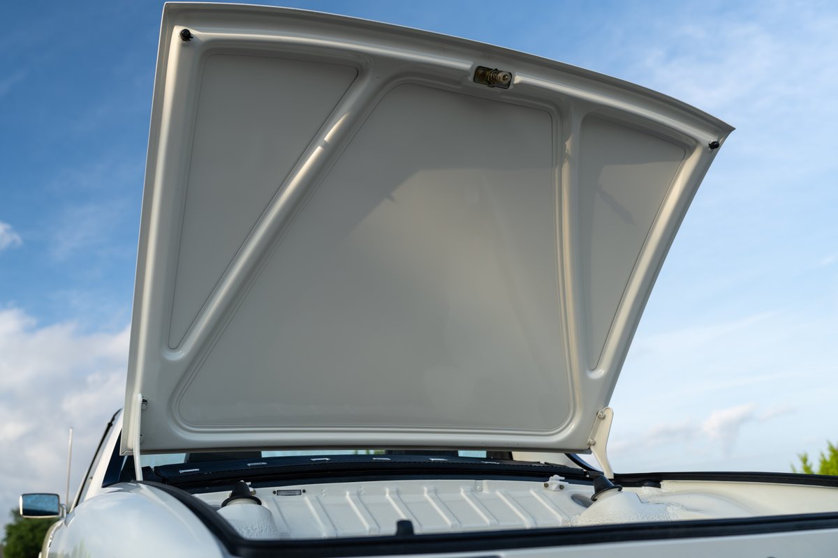 Open hood of a white 1974 Porsche 914 Can-Am LE.