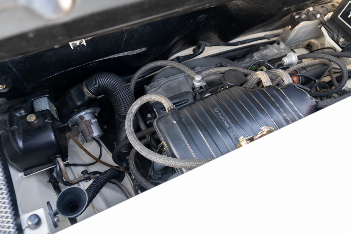 1974 Porsche 914 Can-Am engine bay with engine cover, hoses, and air intake system.