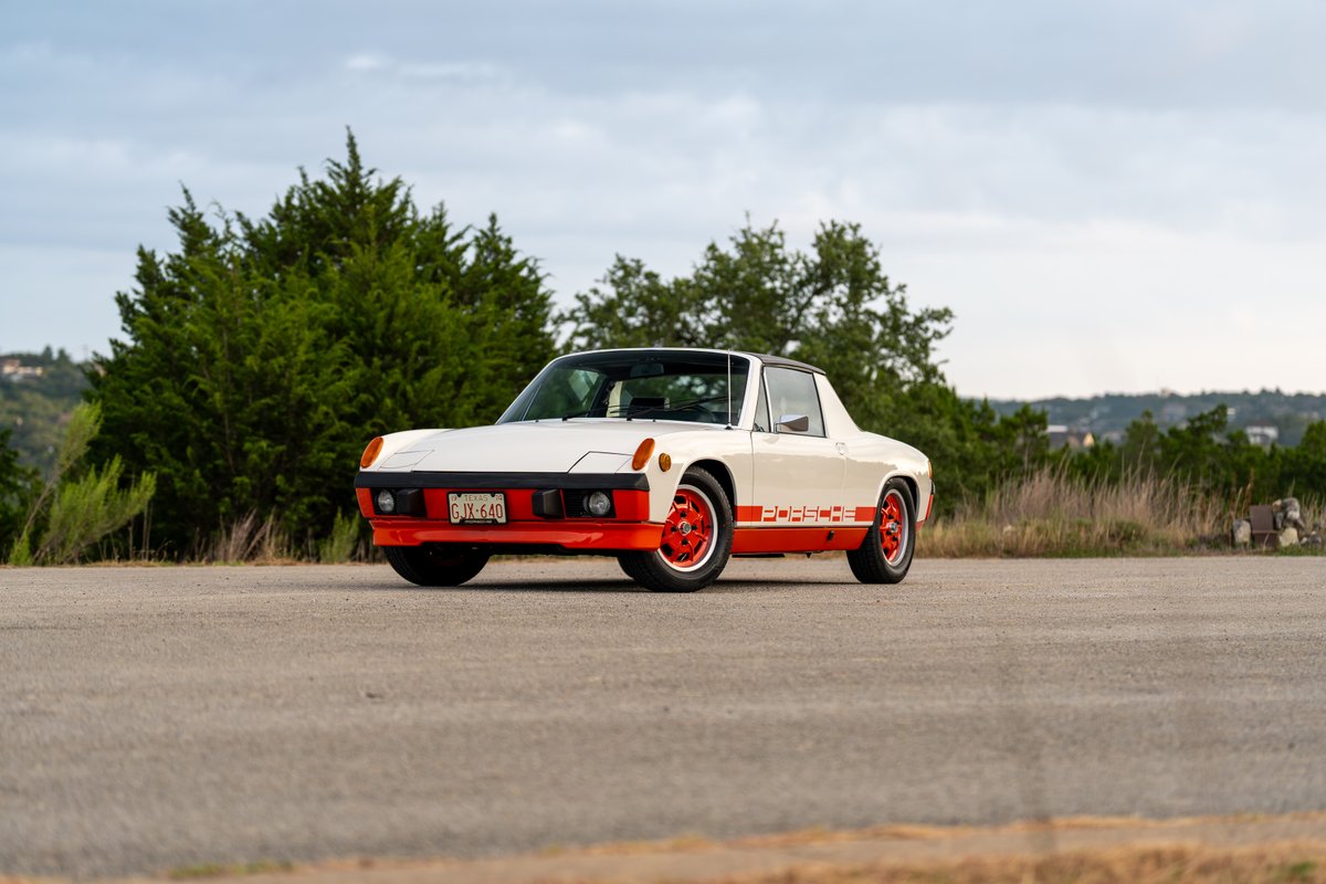 1974 Porsche 914 Can-Am LE in orange and cream with matching rims and livery.