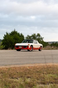 1974 Porsche 914 Can-Am LE in cream and orange. Features distinctive orange front bumper and side livery.