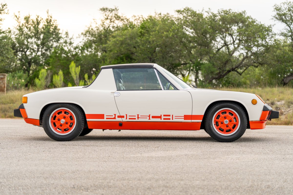 1974 Porsche 914 Can-Am with orange trim and rims.