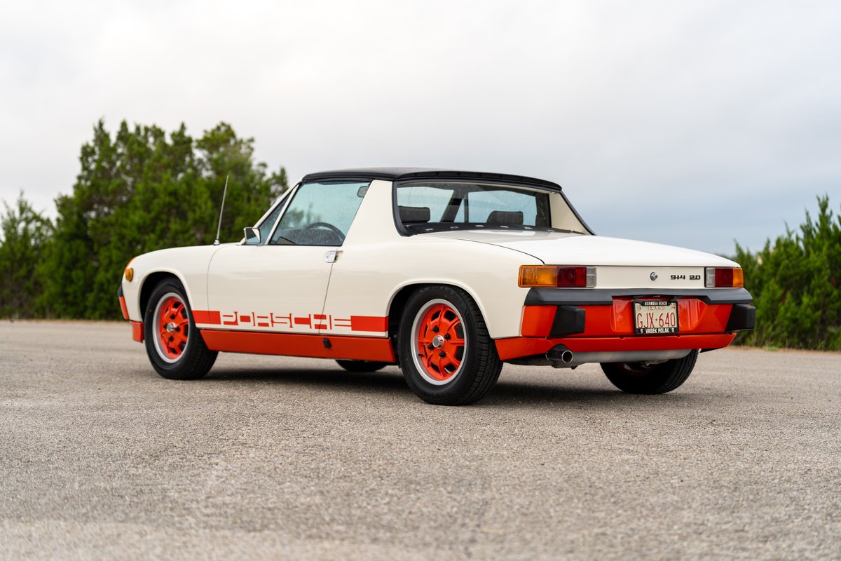 Cream and orange 1974 Porsche 914 Can-Am LE with matching orange rims and side livery.