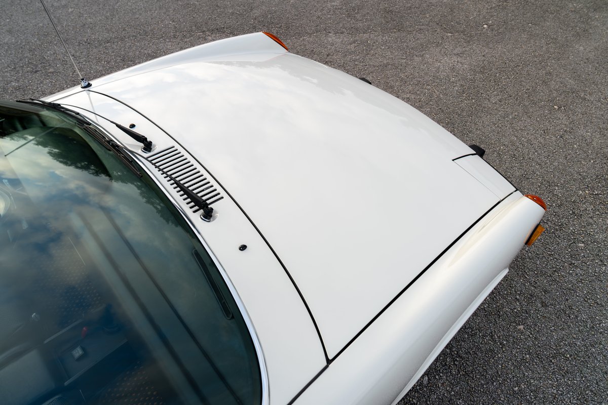 White 1974 Porsche 914 Can-Am LE hood with black trim and wipers.