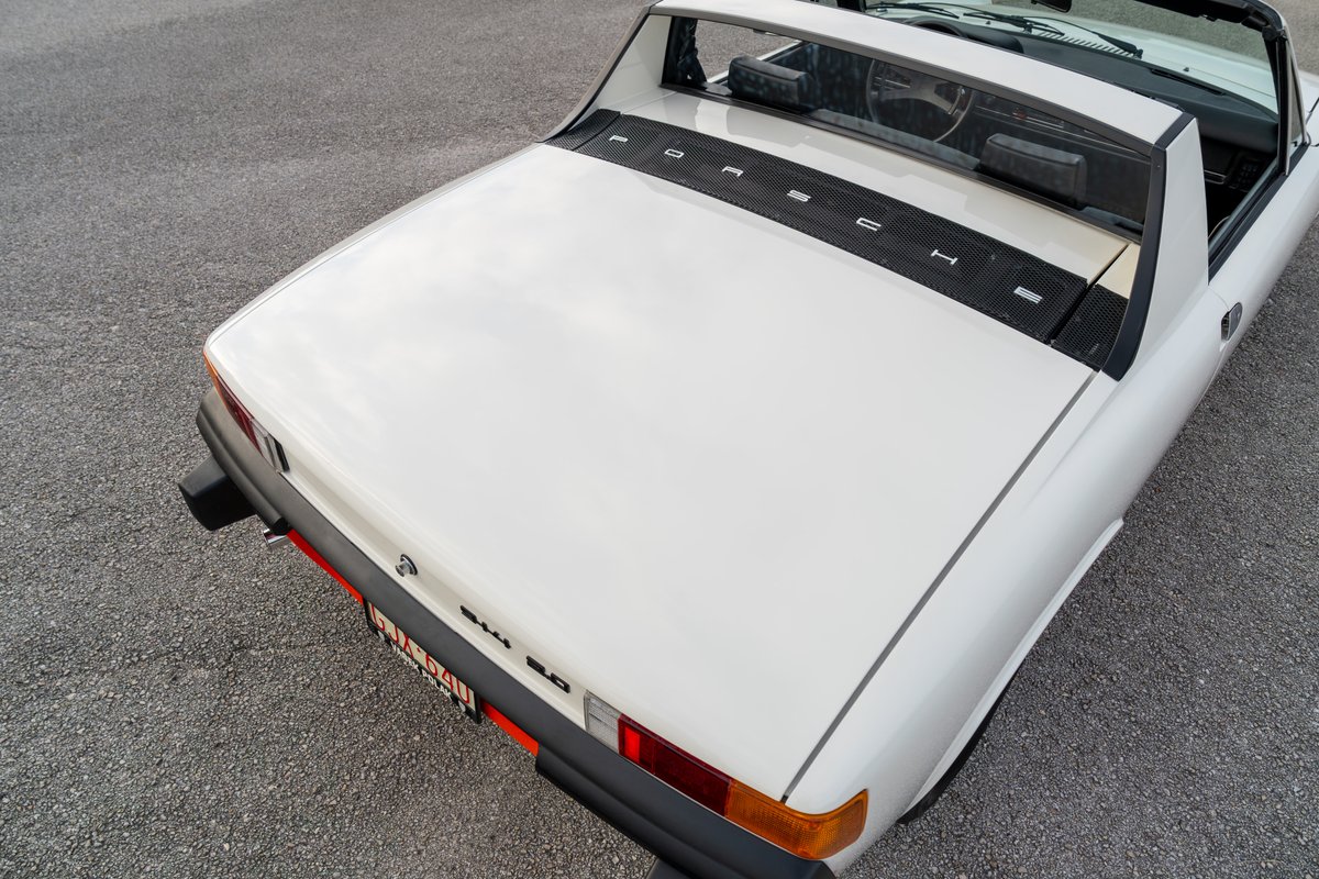 White 1974 Porsche 914 Can-Am LE Targa top rear view with "PORSCHE" badging.