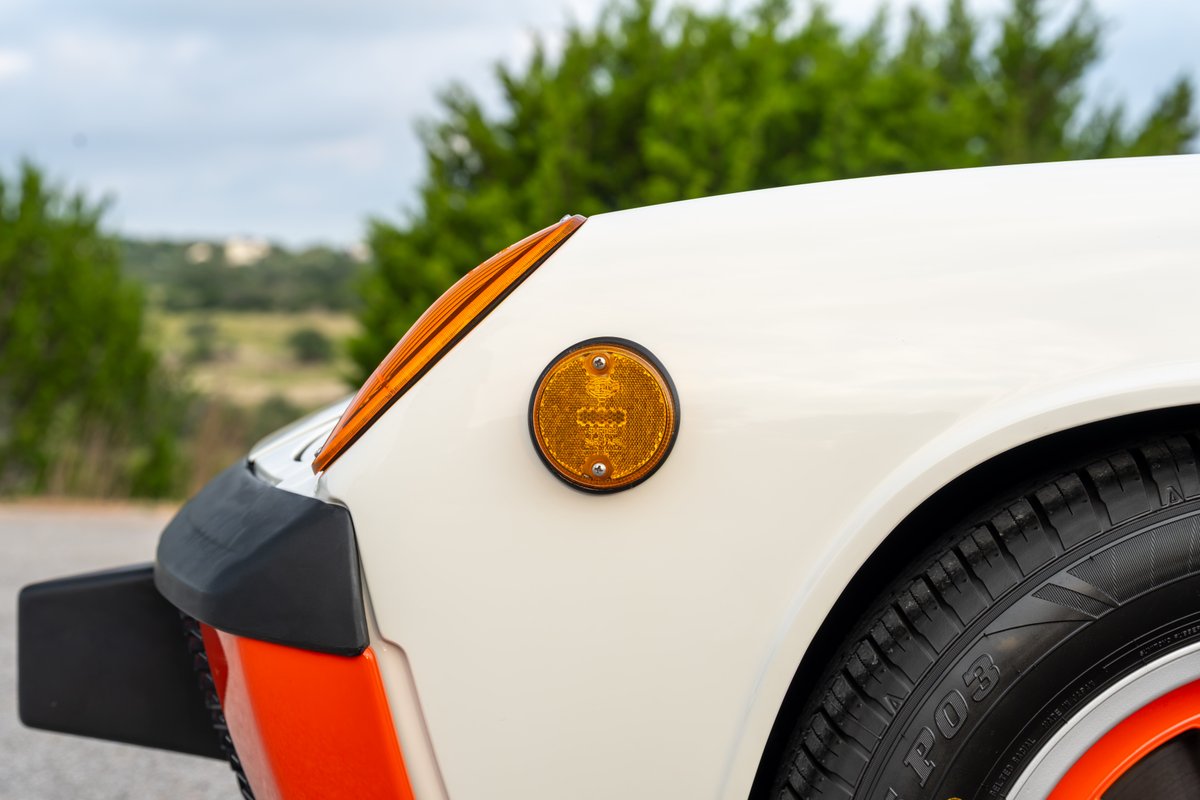 1974 Porsche 914 Can-Am LE: Cream body, orange trim, amber marker light.