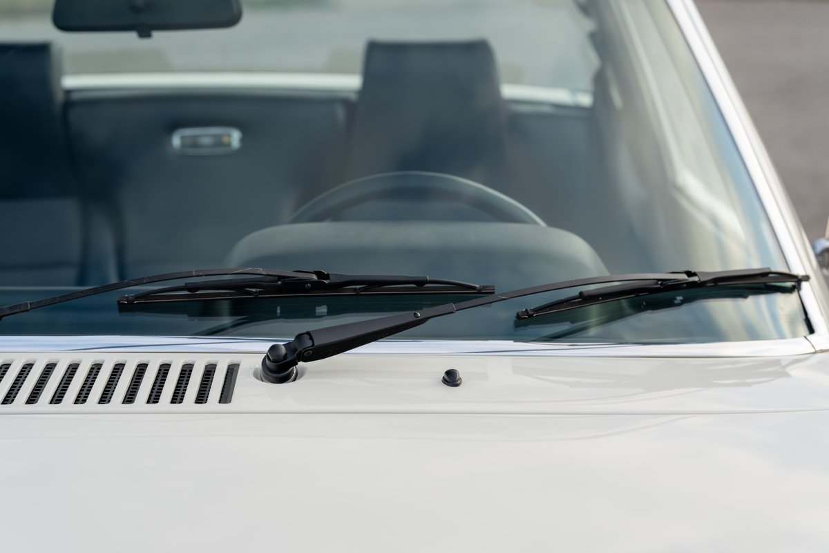 Cream 1974 Porsche 914 Can-Am windshield, wipers, and front grille.