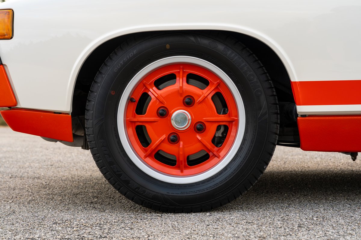 1974 Porsche 914 Can-Am with orange Fuchs wheels and body trim.