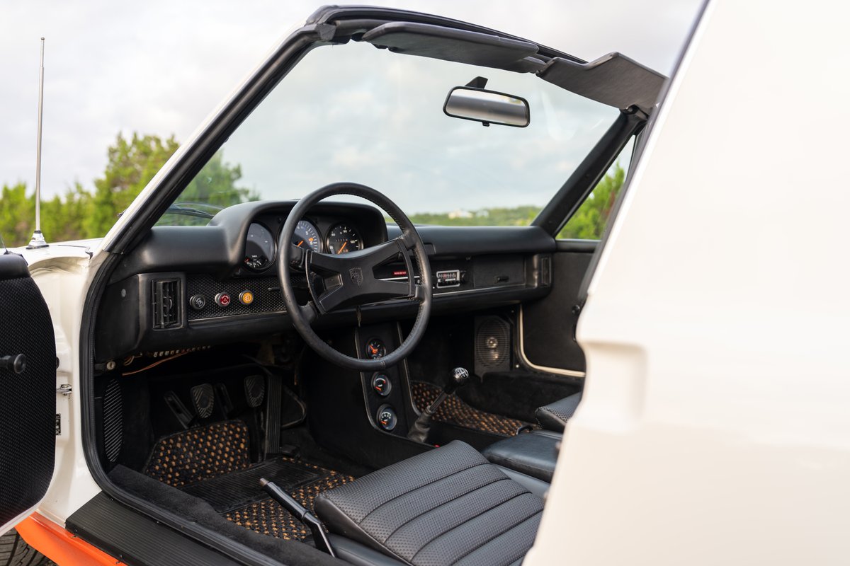 1974 Porsche 914 Can-Am LE interior view, featuring black seats, dashboard, and steering wheel.