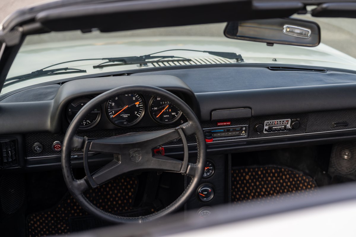 1974 Porsche 914 dashboard with three-gauge cluster and original radio.
