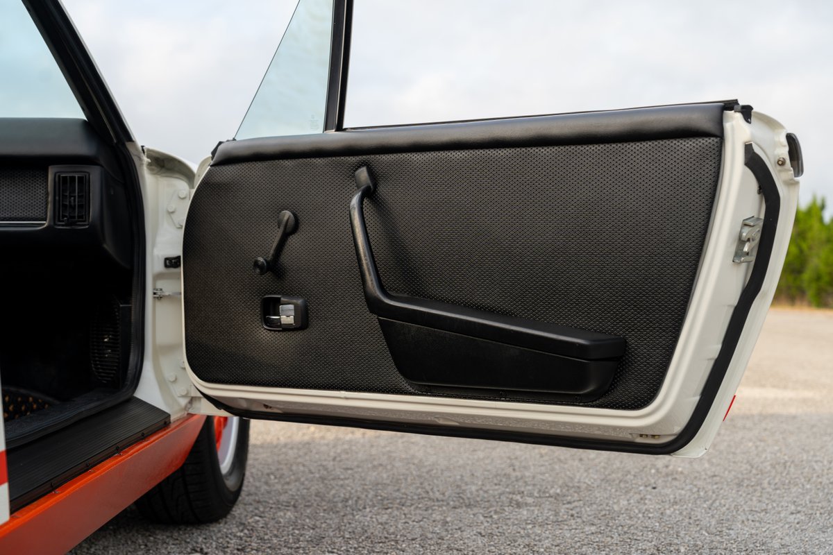 1974 Porsche 914 Can-Am door panel with black trim and textured insert.