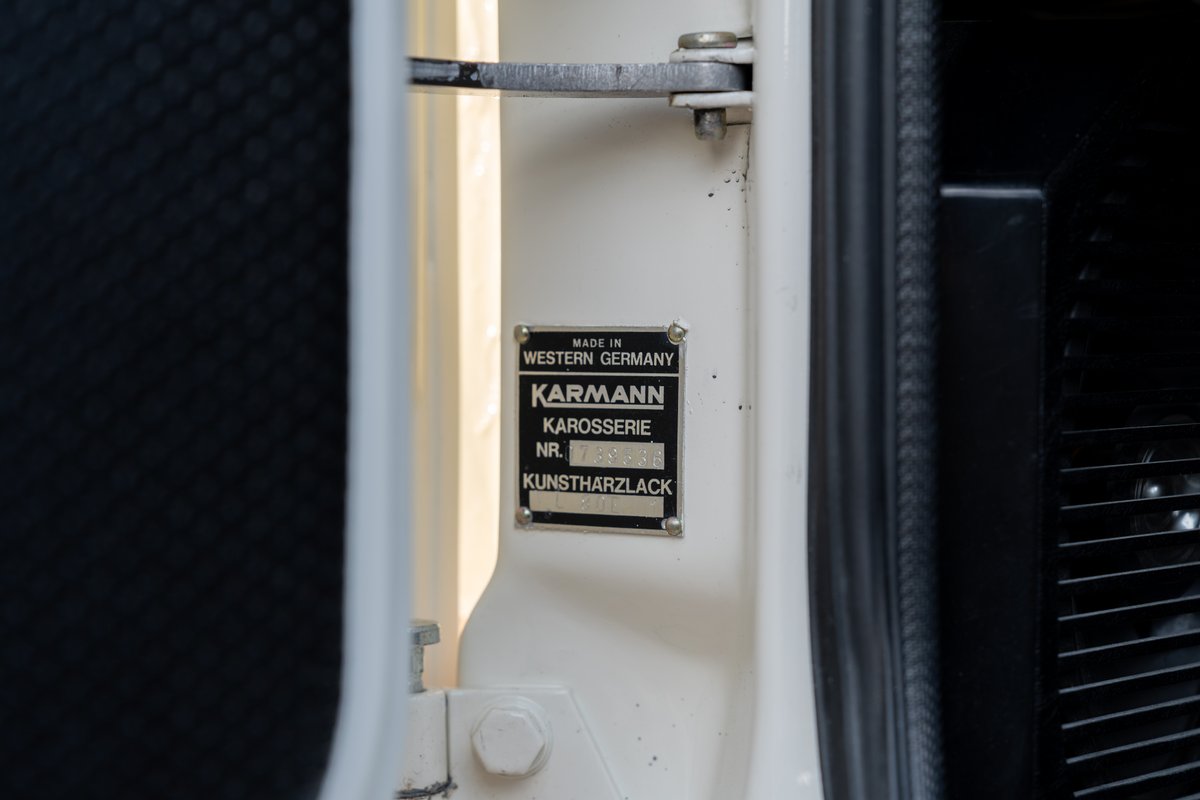 Close-up of a Karmann body plate on a cream 1974 Porsche 914 Can-Am.