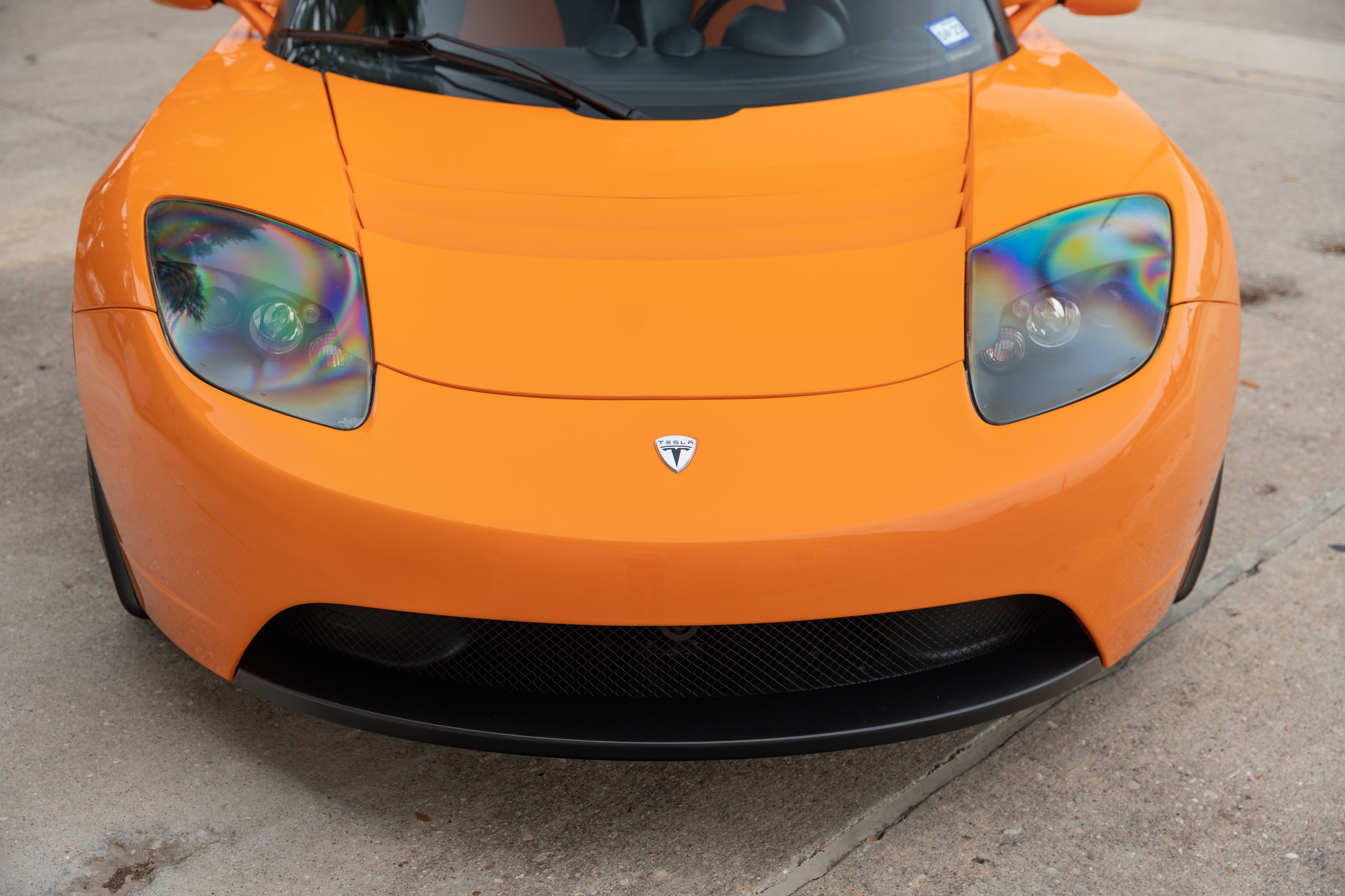 2010 Very Orange Metallic Tesla Roadster in Austin, TX.