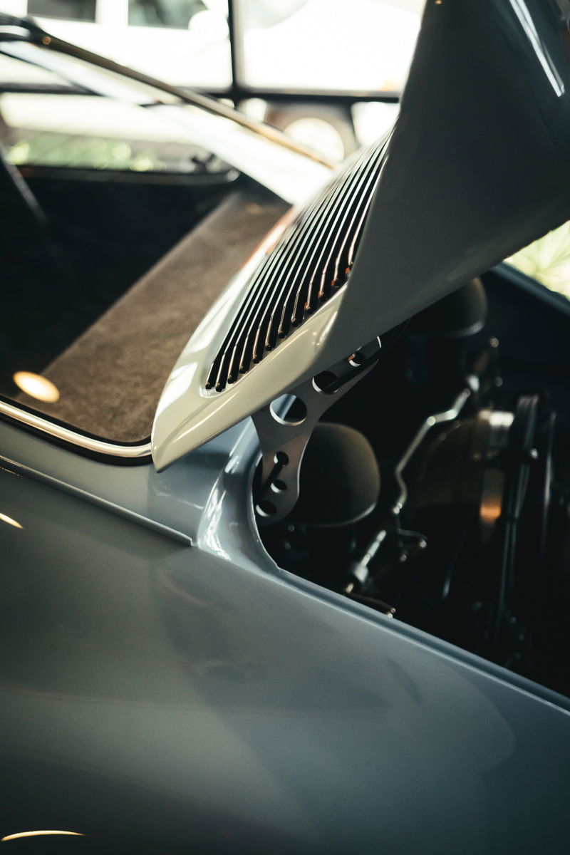 Air-cooled Porsche 911's slate grey rear decklid with vertical engine vents and bespoke lightweight drilled hinges.