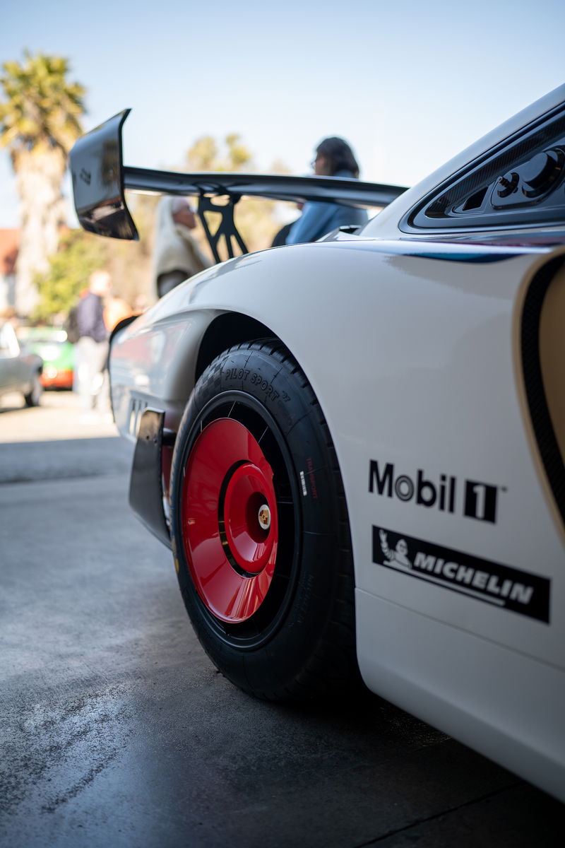 White Porsche 935 with red center-lock rims, Mobil 1 & Michelin livery.
