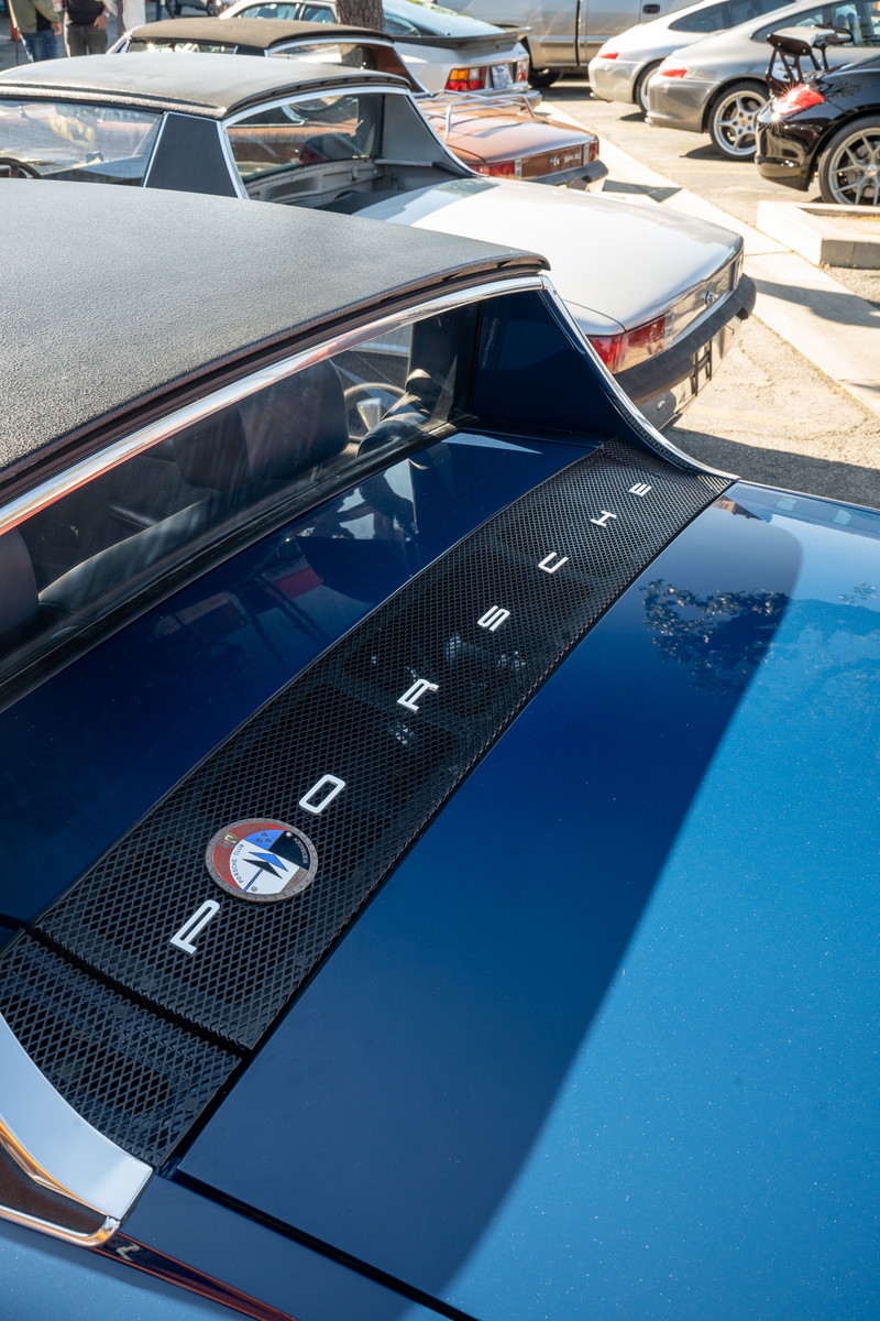 Blue Porsche 914 Targa with "PORSCHE" lettering on engine cover grate.
