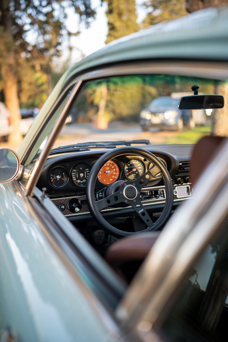 Interior view of a light blue Porsche 911 Targa from the 2022 Lit Show Los Angeles.