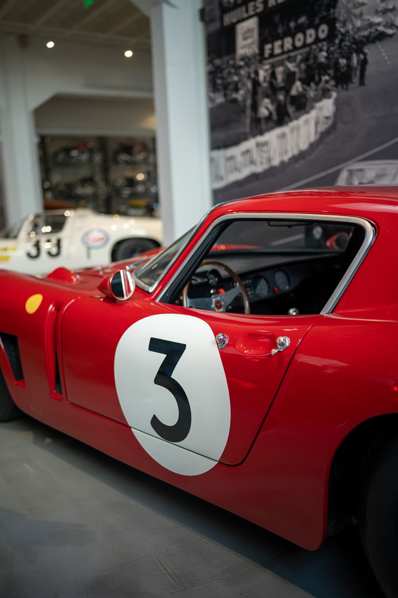 Close-up of a red Ferrari 250 GTO with a number 3 livery on its door.