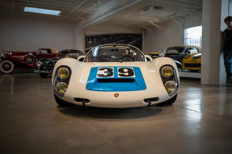 White Porsche 908/03 with blue racing livery and "39" on the hood.