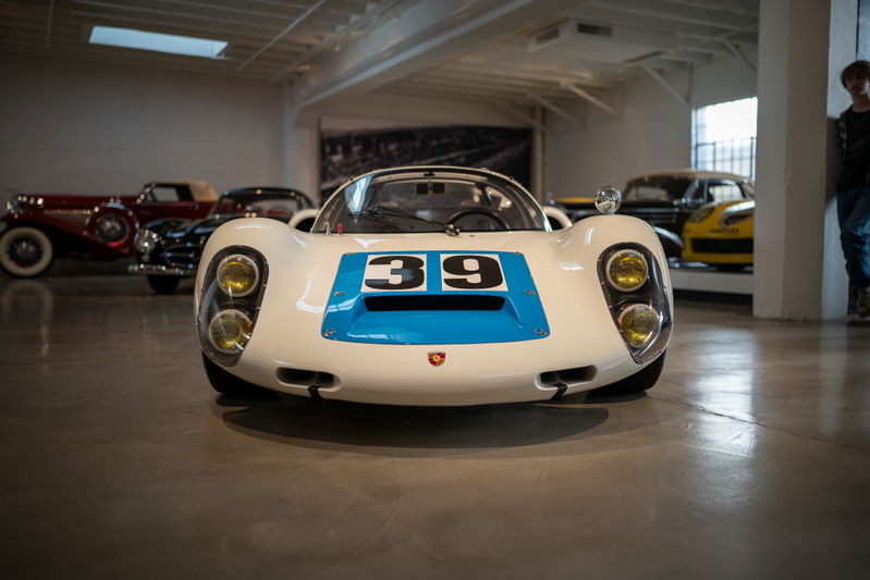 White Porsche 908/03 with blue racing livery and "39" on the hood.