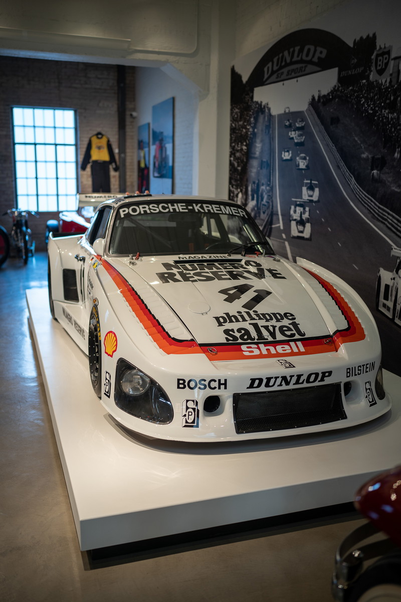 1979 Porsche 935 K3 race car, white livery with orange and red stripes, Dunlop tires.