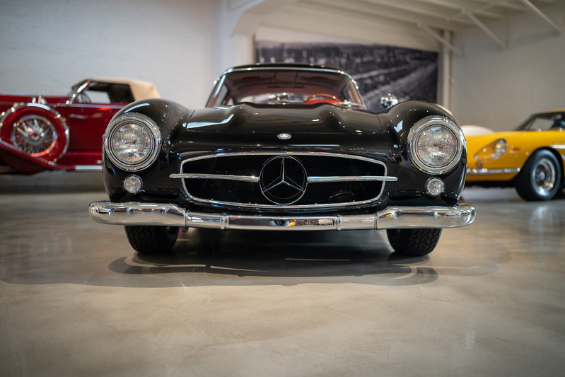 Black Mercedes-Benz 300 SL Gullwing with chrome trim and rims.